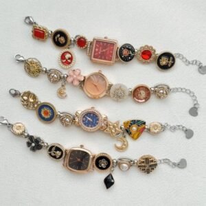 Cybercore wristwatch bracelet using titanium techframe and button-positioned charm tracks