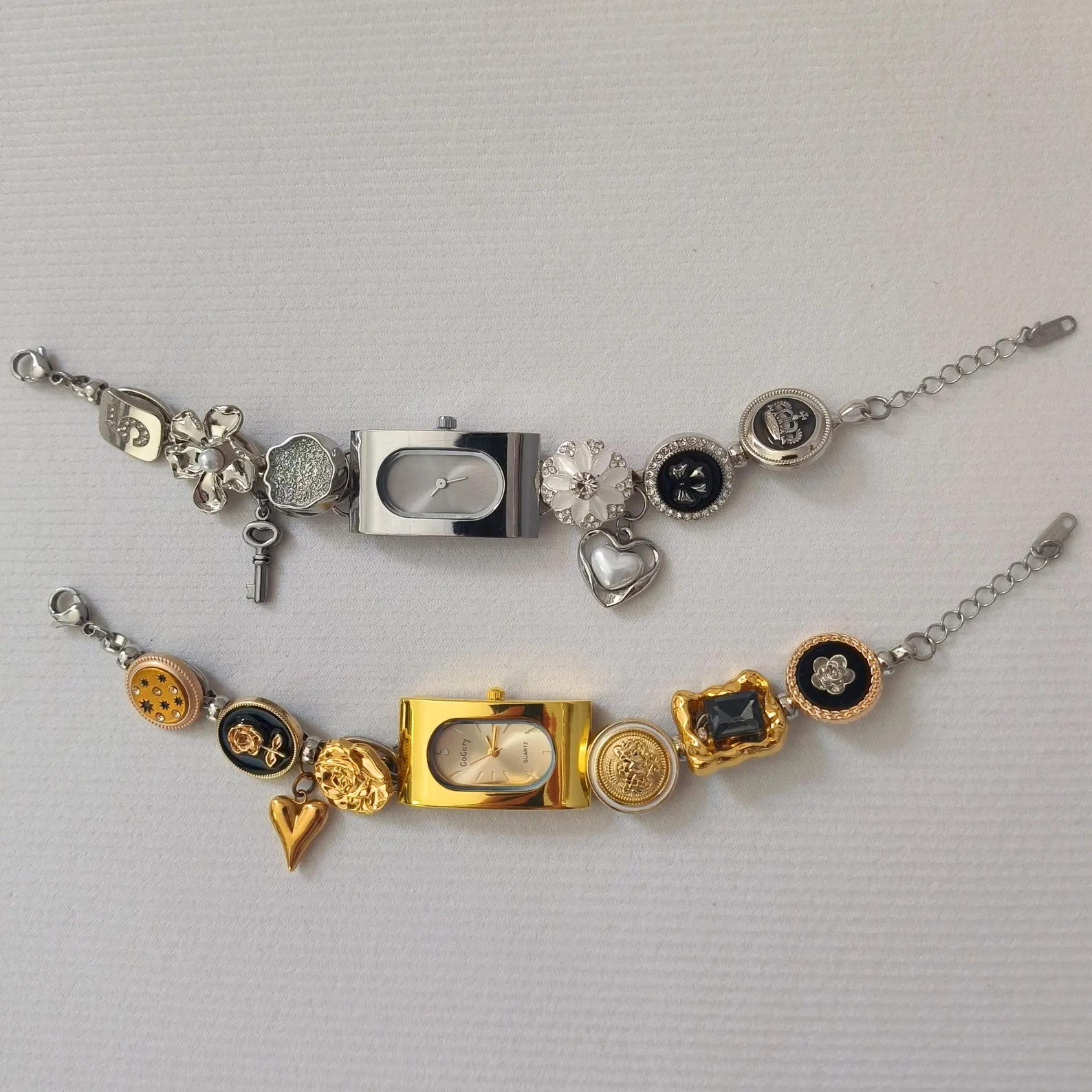 stainless steel bracelet watch with cyber motifs and charm buttons