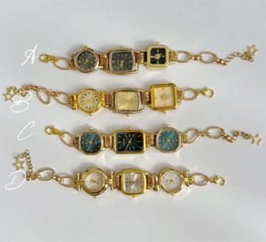 Titanium watch bracelet featuring charms and button accents