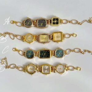 Titanium watch bracelet featuring charms and button accents