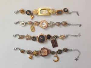 Flat-surfaced bracelet watch design for charm add-ons and simple button control