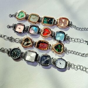 Custom titanium watch bracelet designed for Taylor Swift-inspired fashion using buttons and ornamental charms