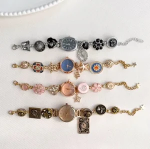 Feminine stainless steel watch bracelet with moon charms and clasp buttons