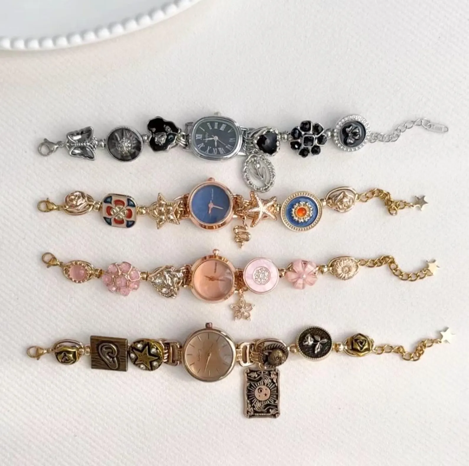 Feminine stainless steel watch bracelet with moon charms and clasp buttons