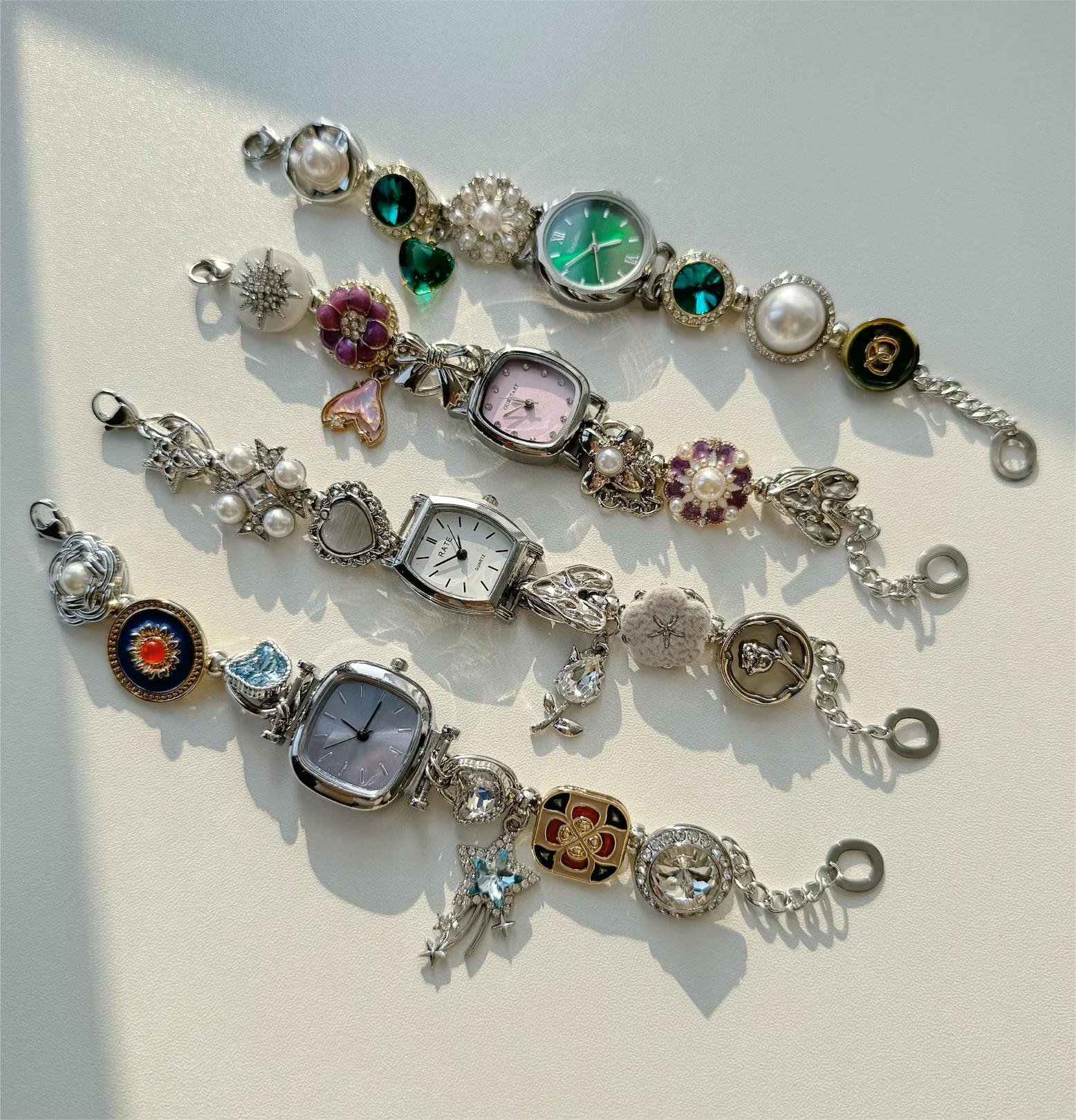 Stainless steel wrist bracelet crafted as a fashion watch with custom charm and button features