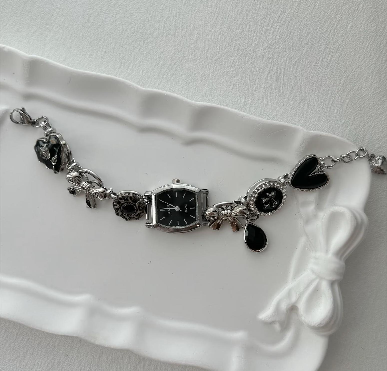Titanium bracelet tailored for cyberpunk wardrobes showcasing clean buttons and creative charm layout