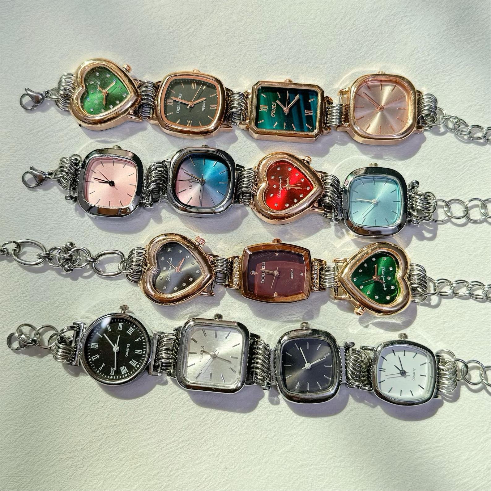 Statement stainless steel watch bracelet crafted for Taylor Swift looks, using mechanical buttons and delicate charms