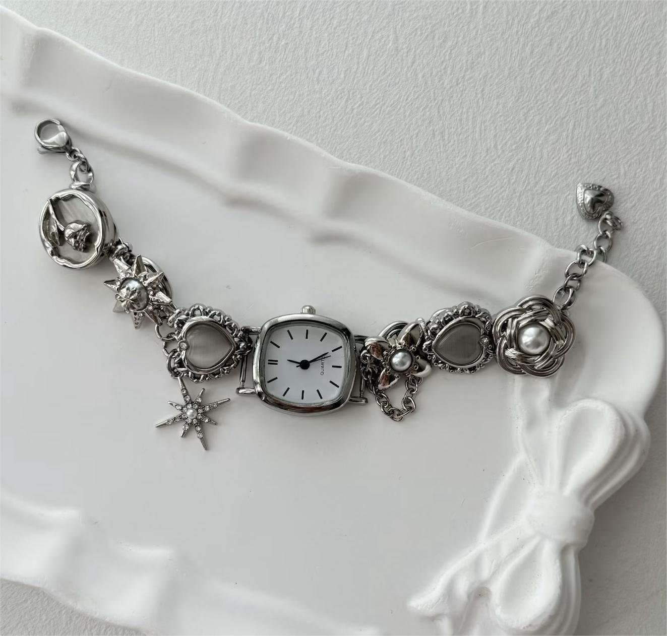 Titanium watch bracelet handmade for cyberpunk fans highlighting button design and charm composition