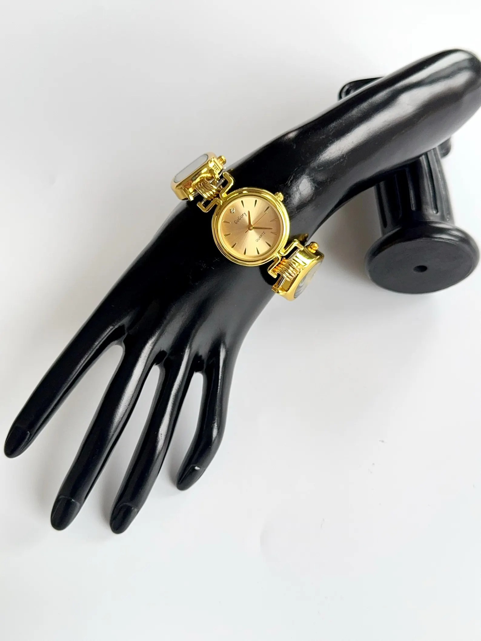 Refined bracelet watch architecture centered on titanium elements, modular charm style, and responsive button zones