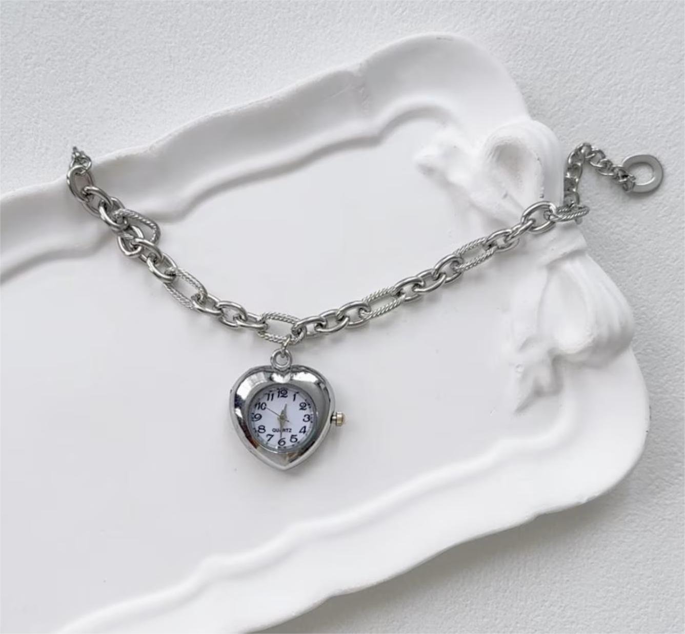 Titanium wrist bracelet designed as a Taylor Swift fashion tribute using floating charms and fastener buttons
