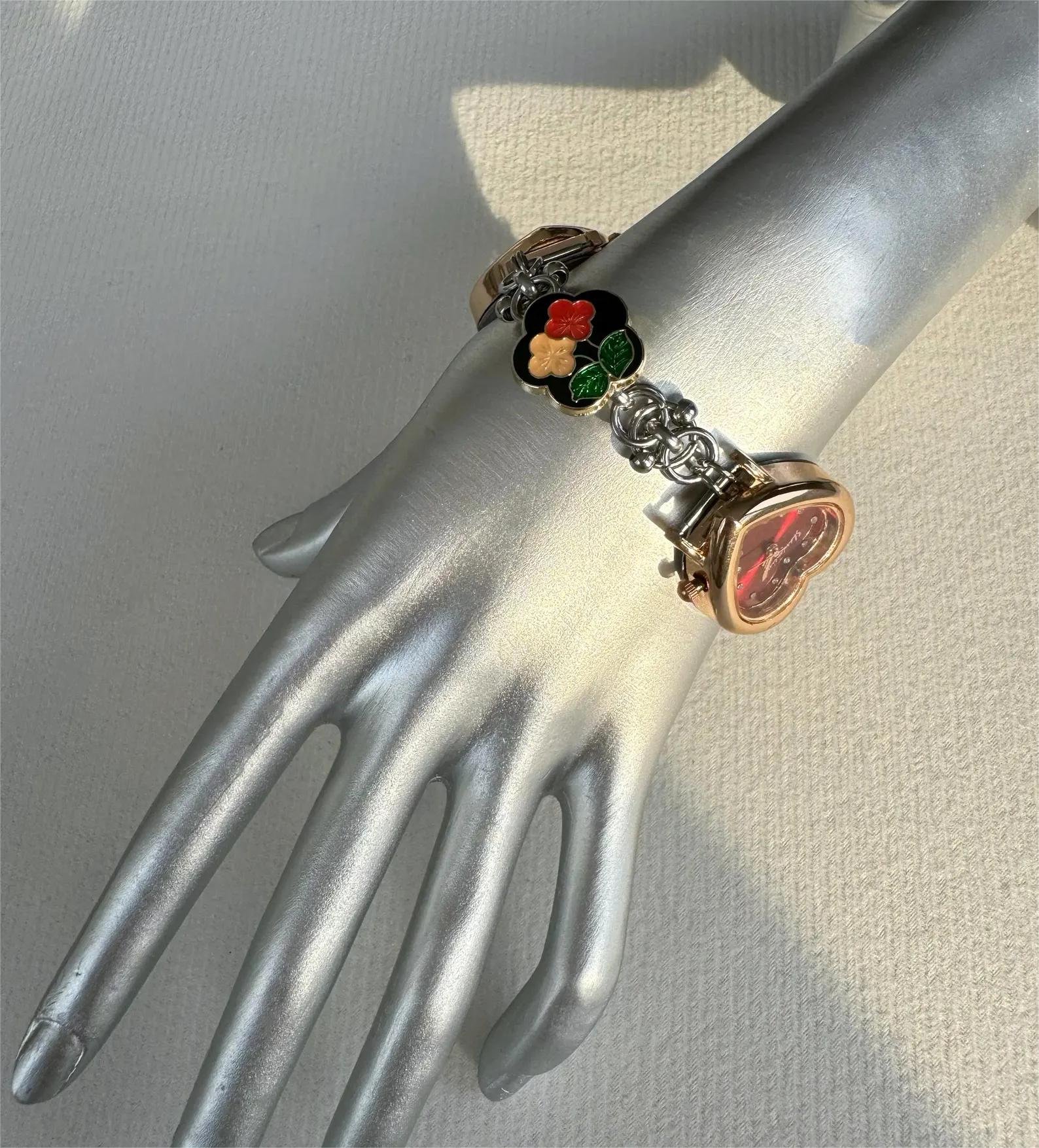 Futuristic street-style watch bracelet using titanium buttons and linear charms