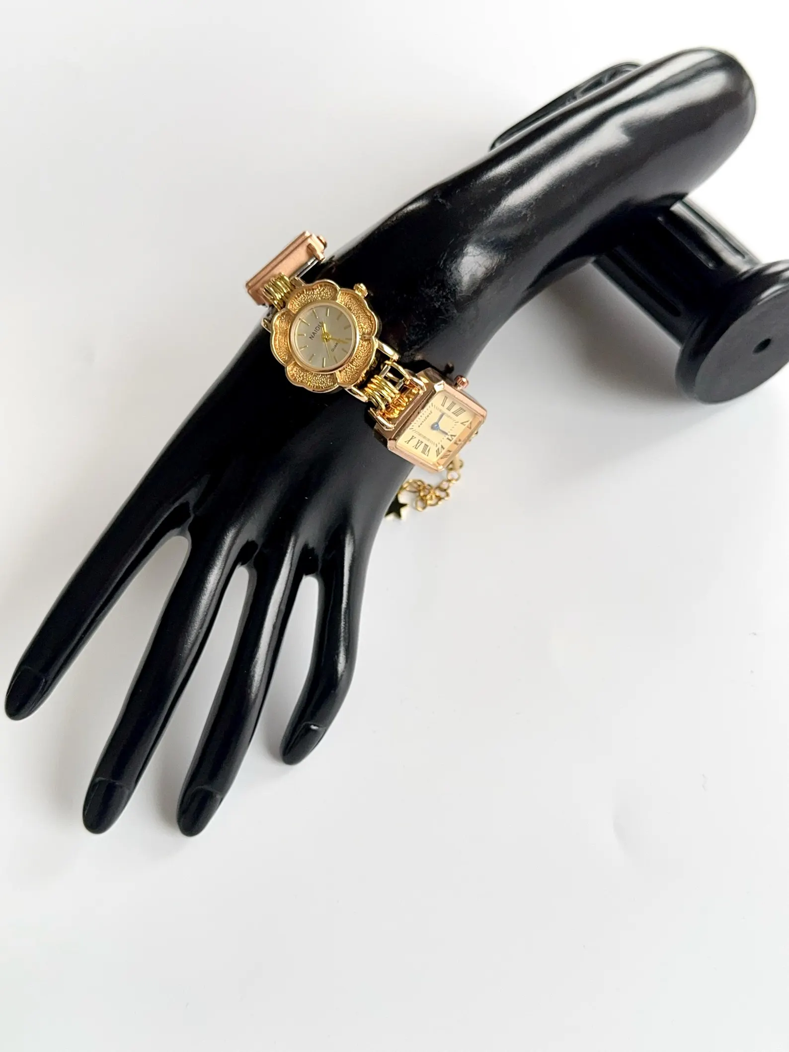 Statement titanium bracelet watch featuring handmade charms and mechanical buttons