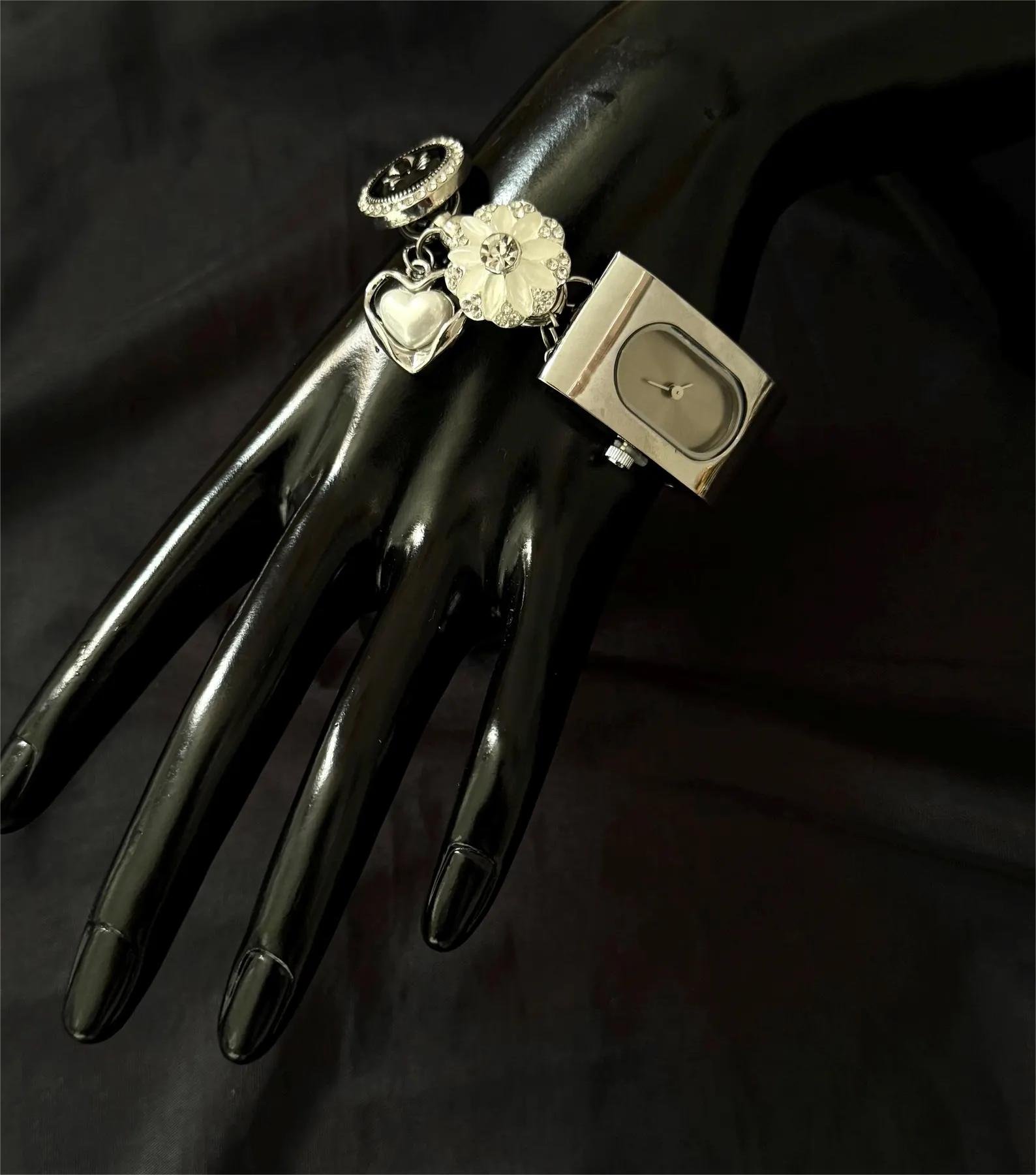 Compact titanium bracelet watch integrating wearable charm and button design