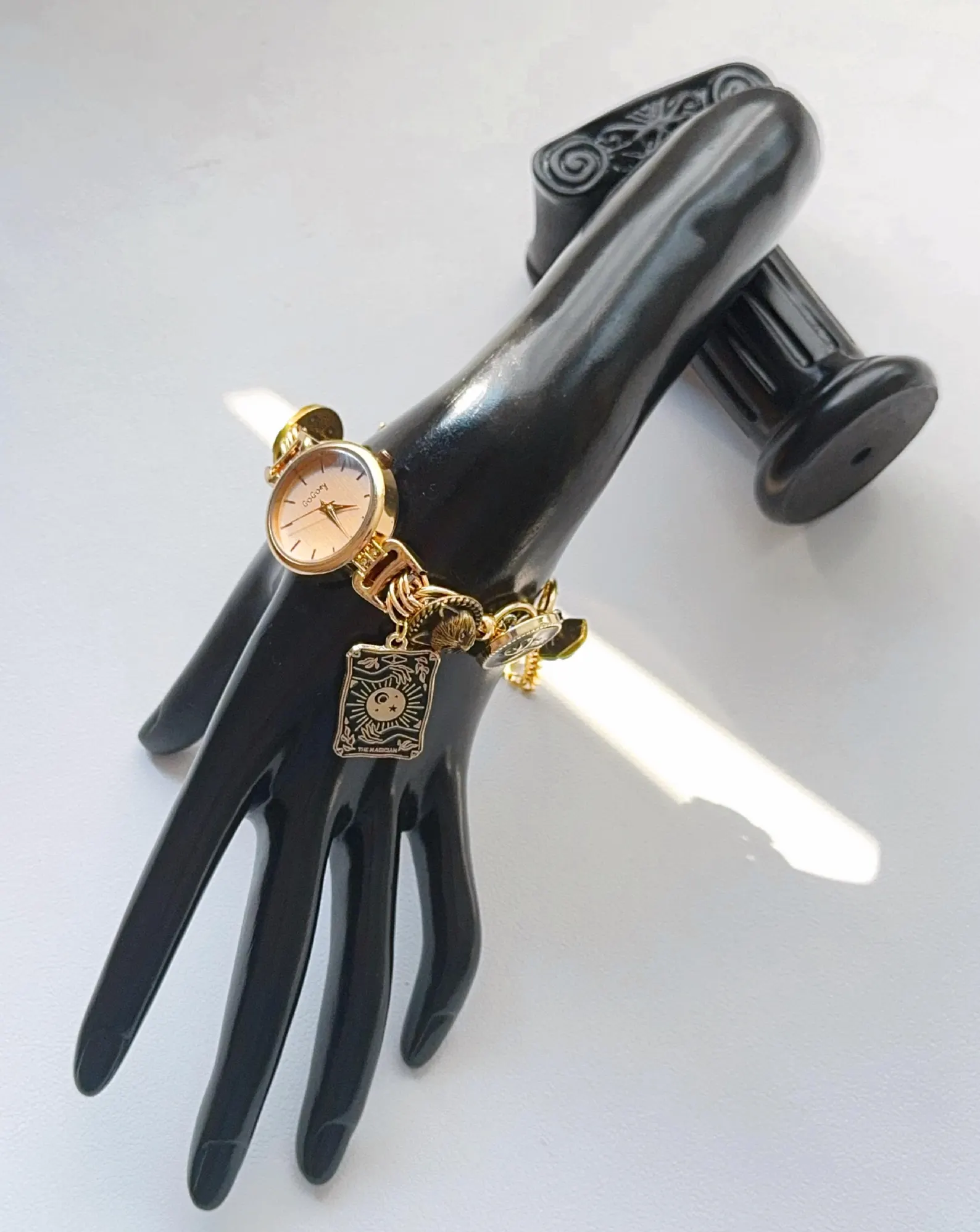 Handmade titanium bracelet watch with star charms and mechanical buttons