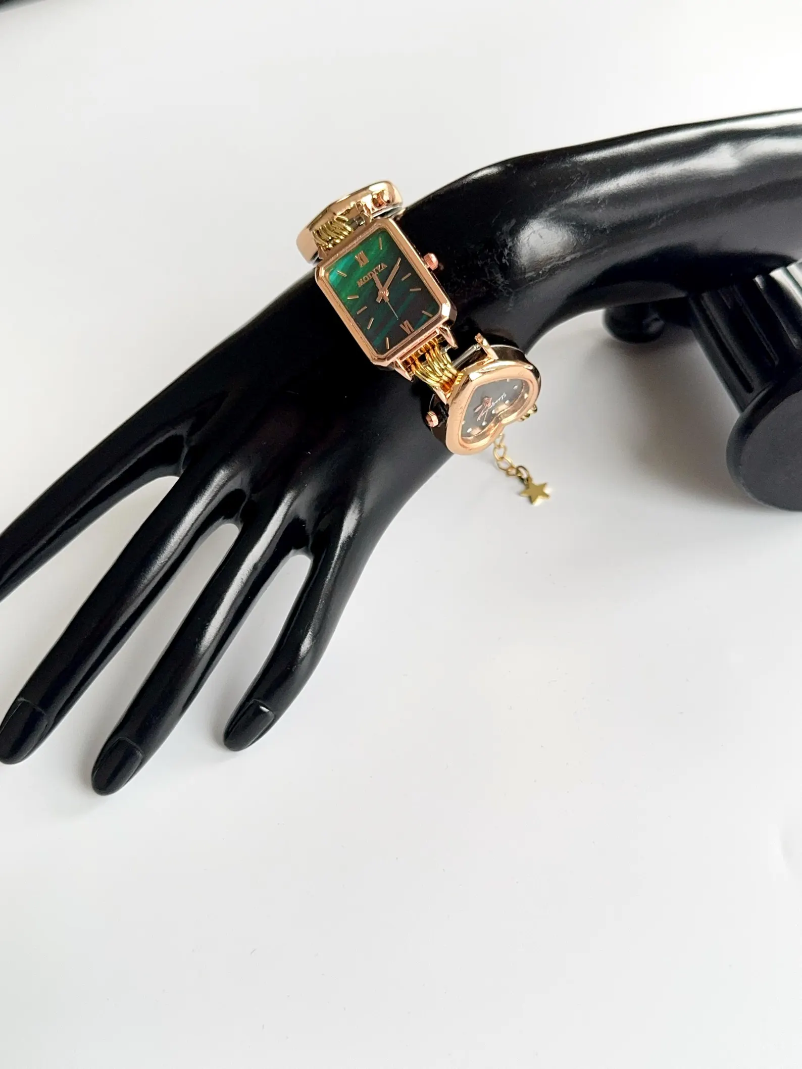 Handmade watch bracelet crafted in titanium, button closure and charm design