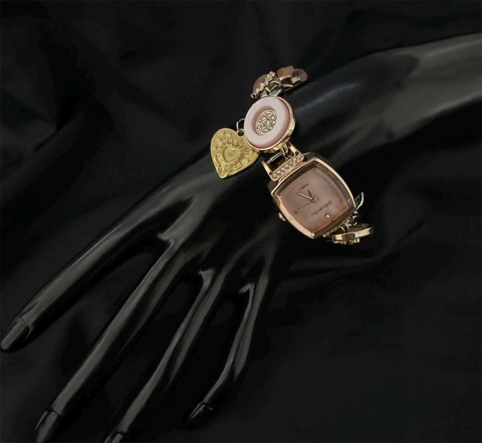 Titanium watch bracelet handmade for cyberpunk appeal featuring mechanical buttons and accent charms