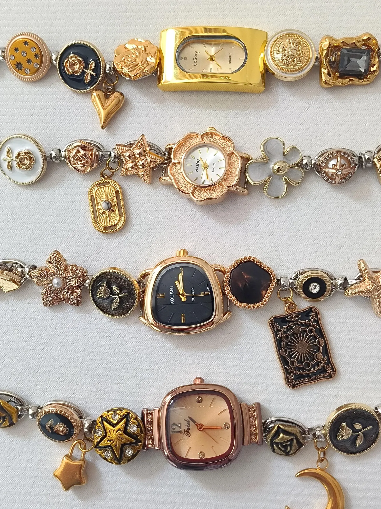 Architectural fashion bracelet watch built from stainless steel, charm flow, and modular button layout