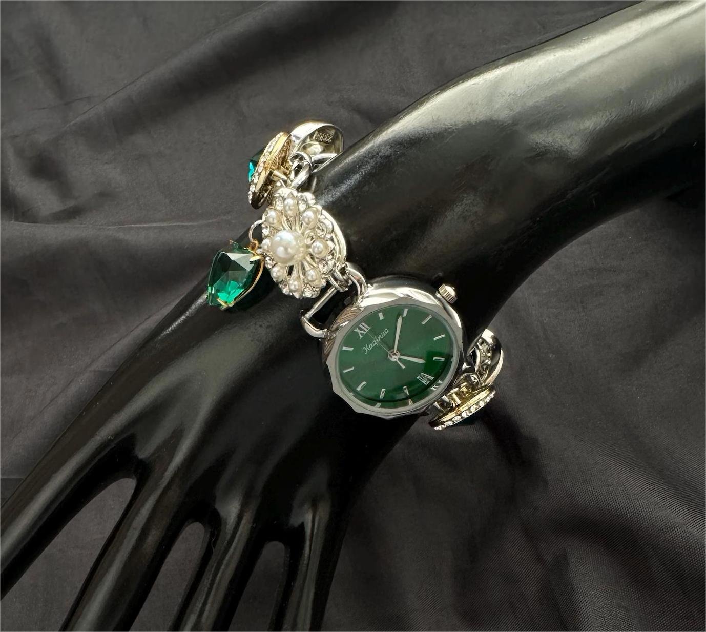 Compact bracelet watch structure for fashion ensembles featuring charm paneling and control buttons