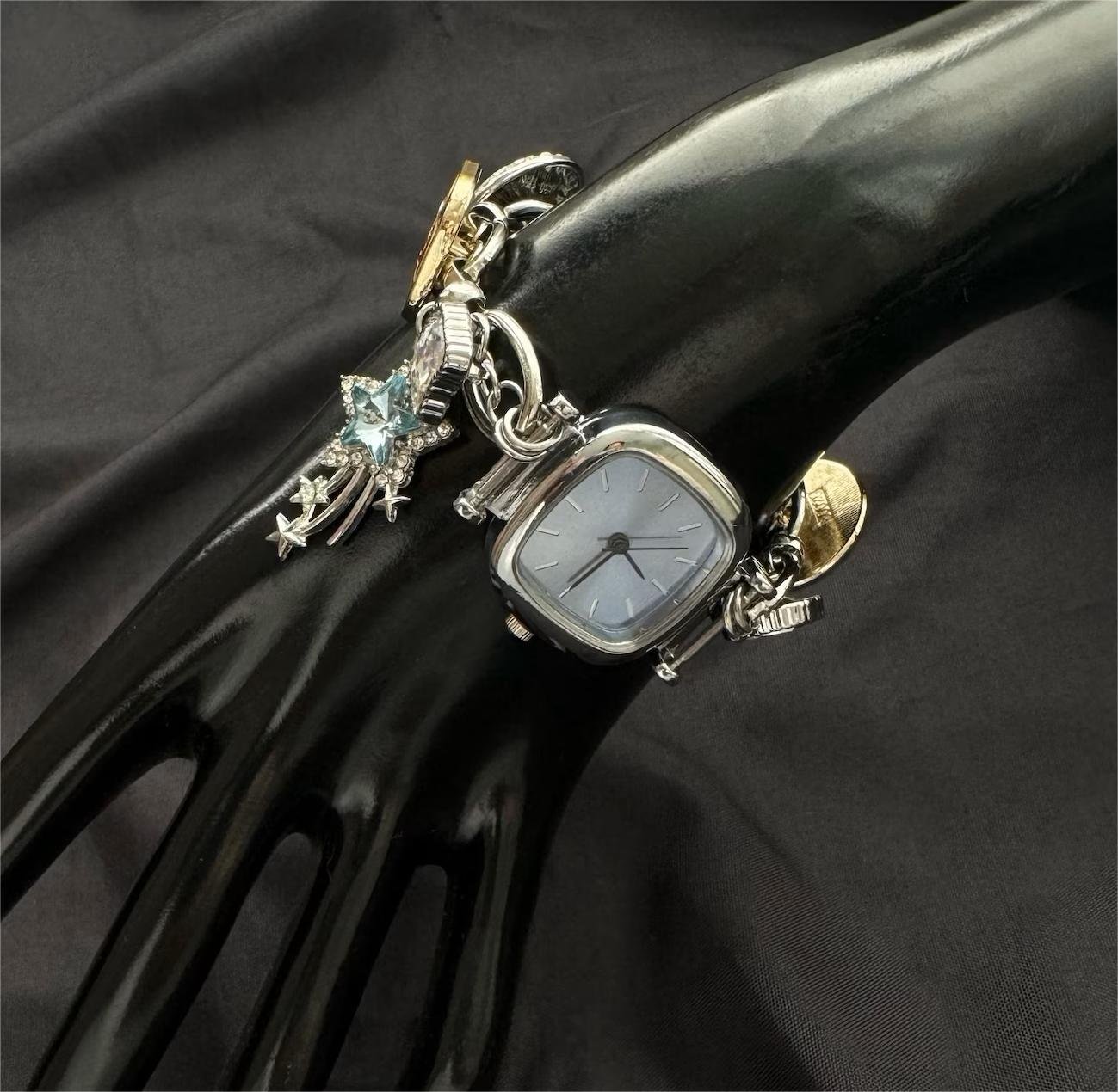 Modular street bracelet watch for women using charm integration and multi-point buttons