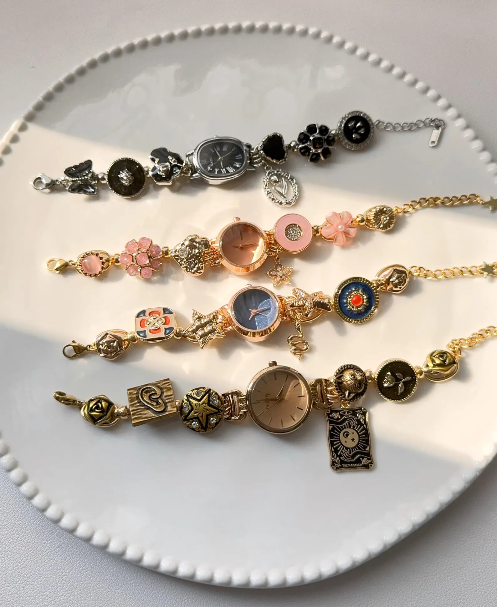 titanium watch bracelet with butterfly charms and metallic buttons