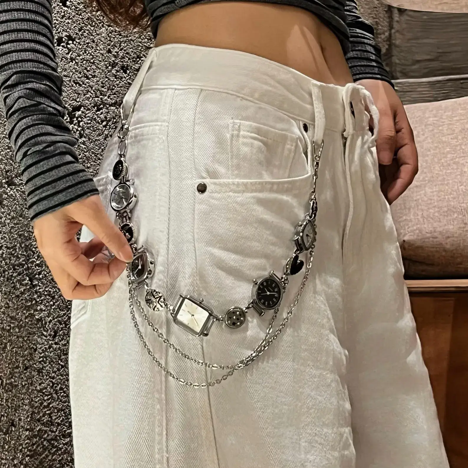 Close-up of titanium y2k style watch pants chain cyberpunk streetwear jewelry