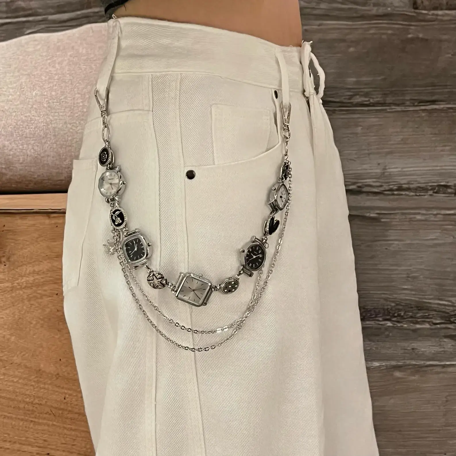 Close-up of titanium y2k style watch pants chain cyberpunk streetwear jewelry
