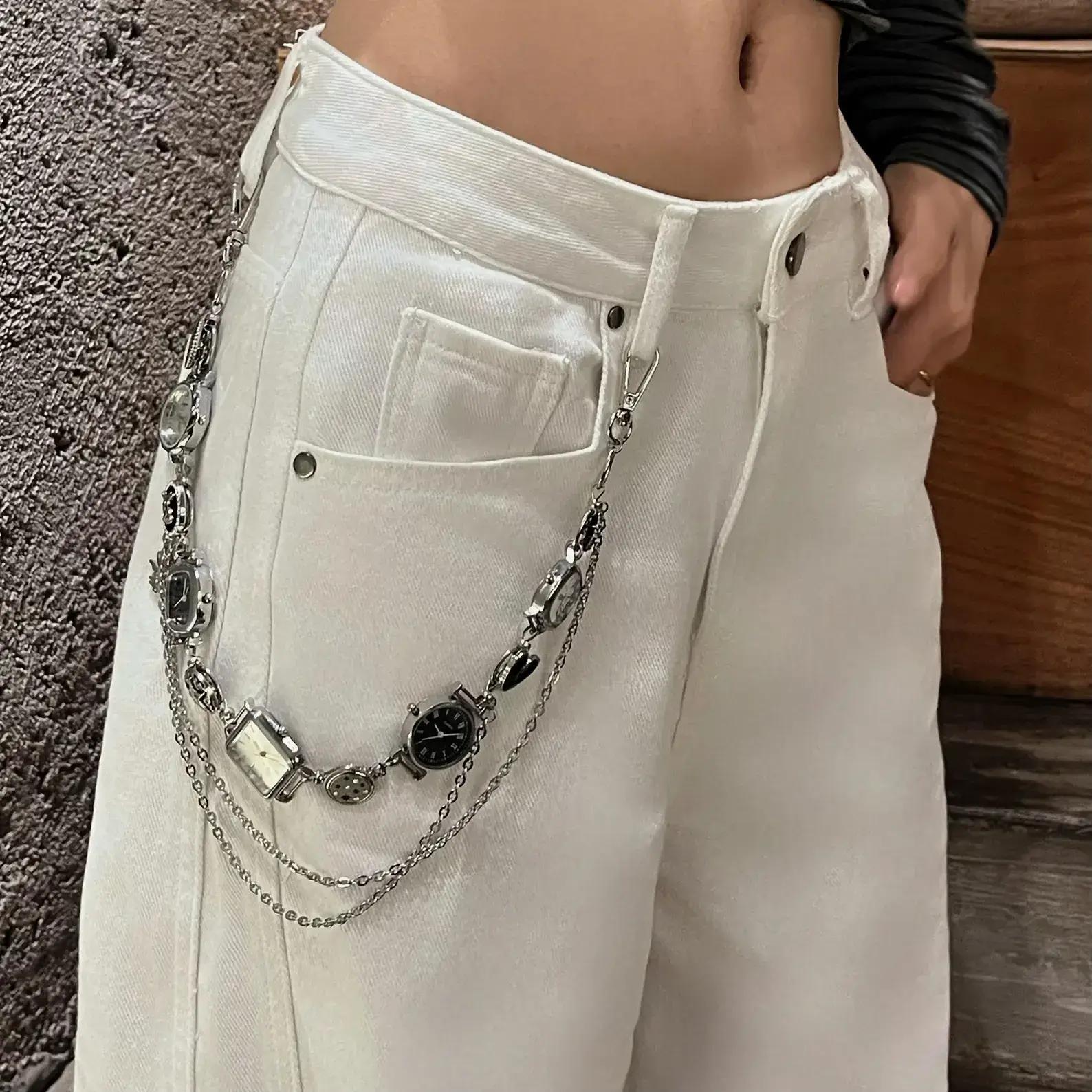 Close-up of titanium y2k style watch pants chain cyberpunk streetwear jewelry