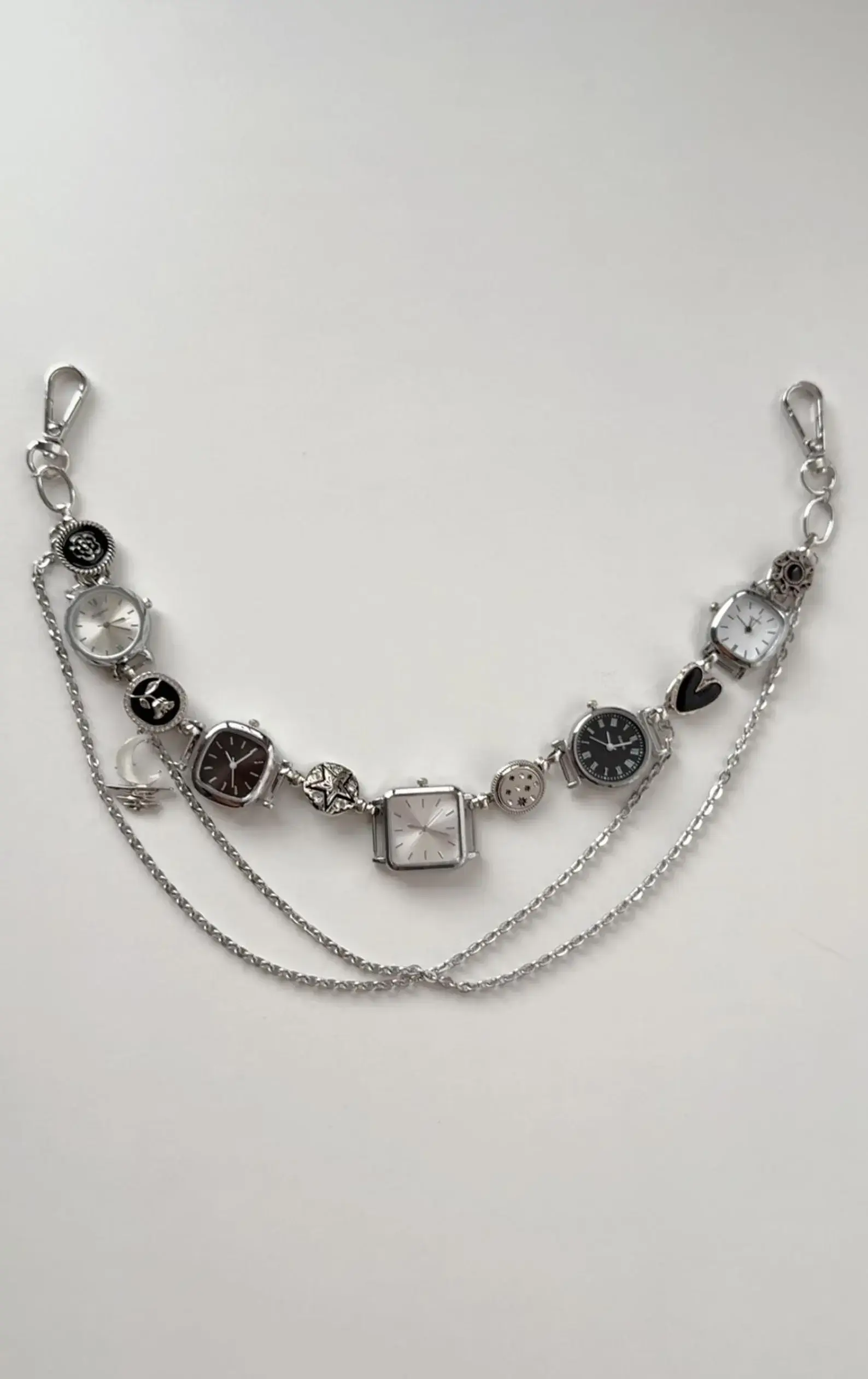Close-up of titanium y2k style watch pants chain cyberpunk streetwear jewelry