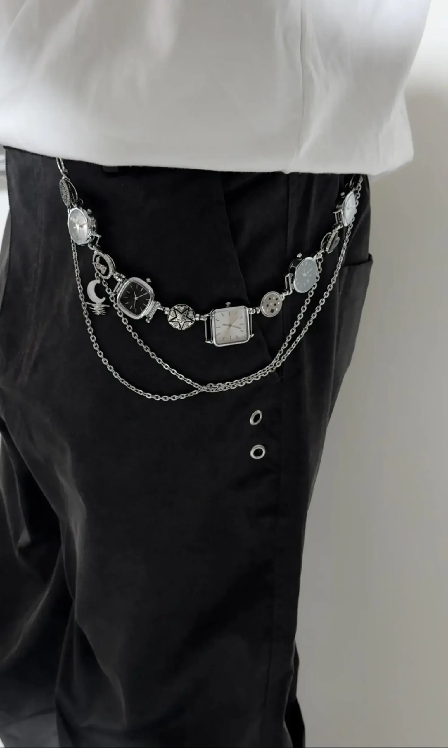 Close-up of titanium y2k style watch pants chain cyberpunk streetwear jewelry
