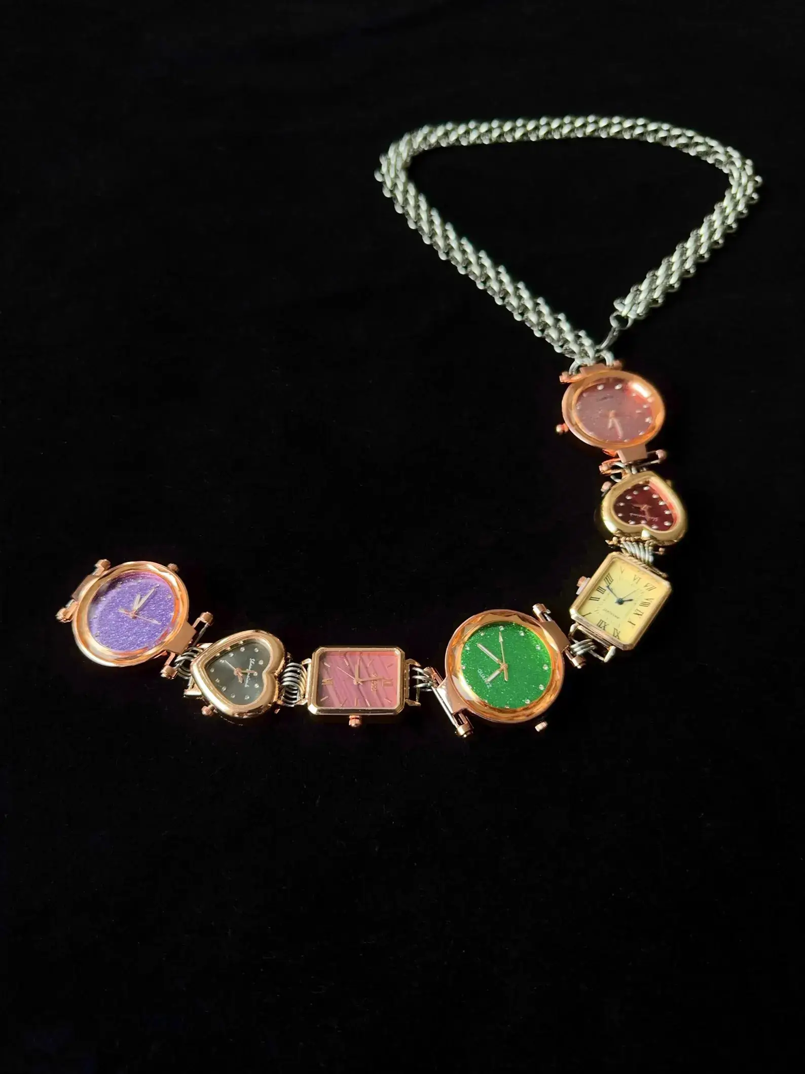 Y2K handmade celebrity watch necktie: A retro-inspired accessory featuring a functional mini watch on a stylish chain, designed to be worn around the neck, capturing the essence of early 2000s fashion with a celebrity touch.