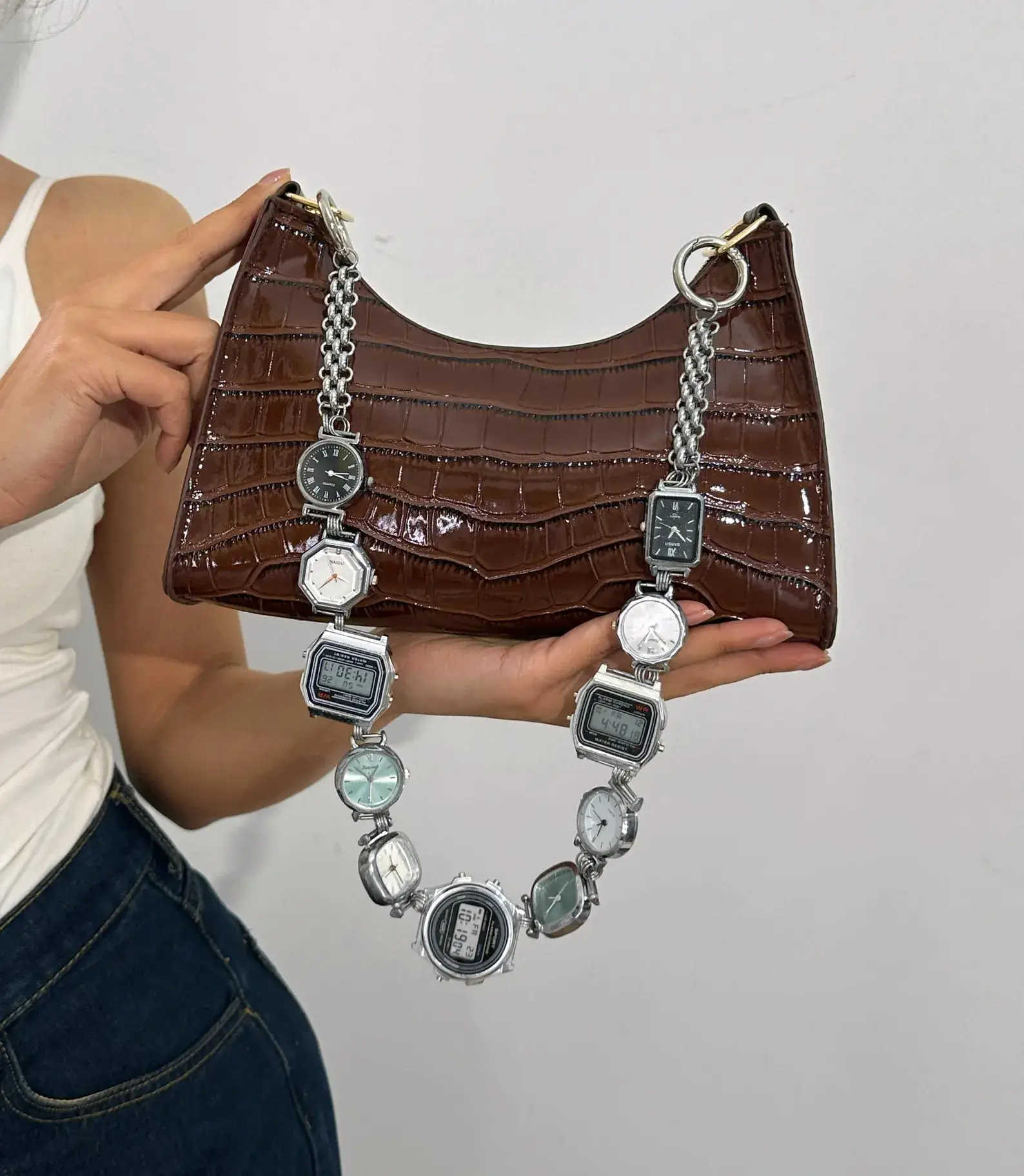 Gothic punk silver bag chain styled by Travis Scott
