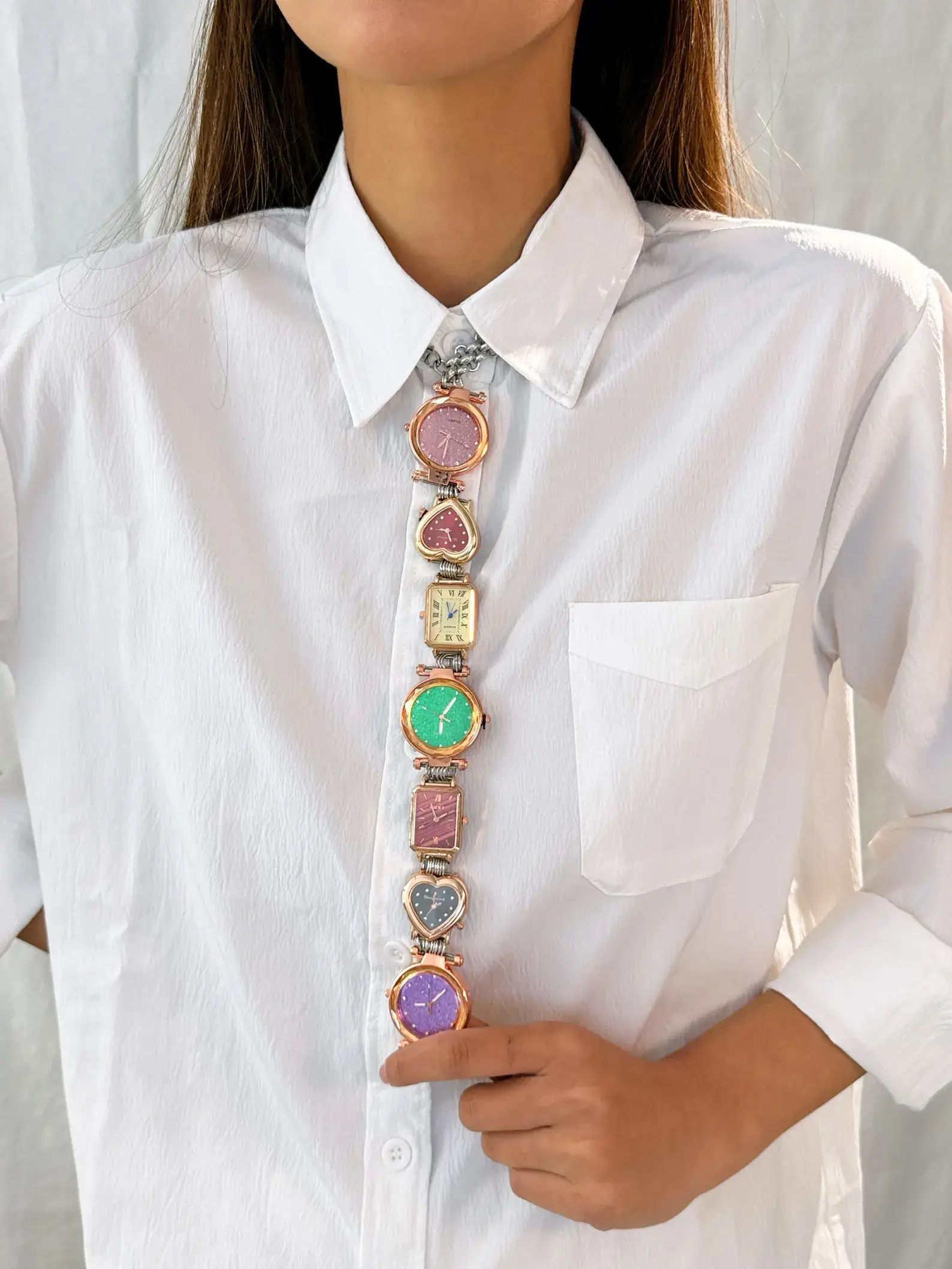 Y2K handmade celebrity watch necktie: A retro-inspired accessory featuring a functional mini watch on a stylish chain, designed to be worn around the neck, capturing the essence of early 2000s fashion with a celebrity touch.