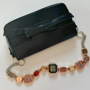 Elegant pearl watch bag chain styled by Bella Hadid