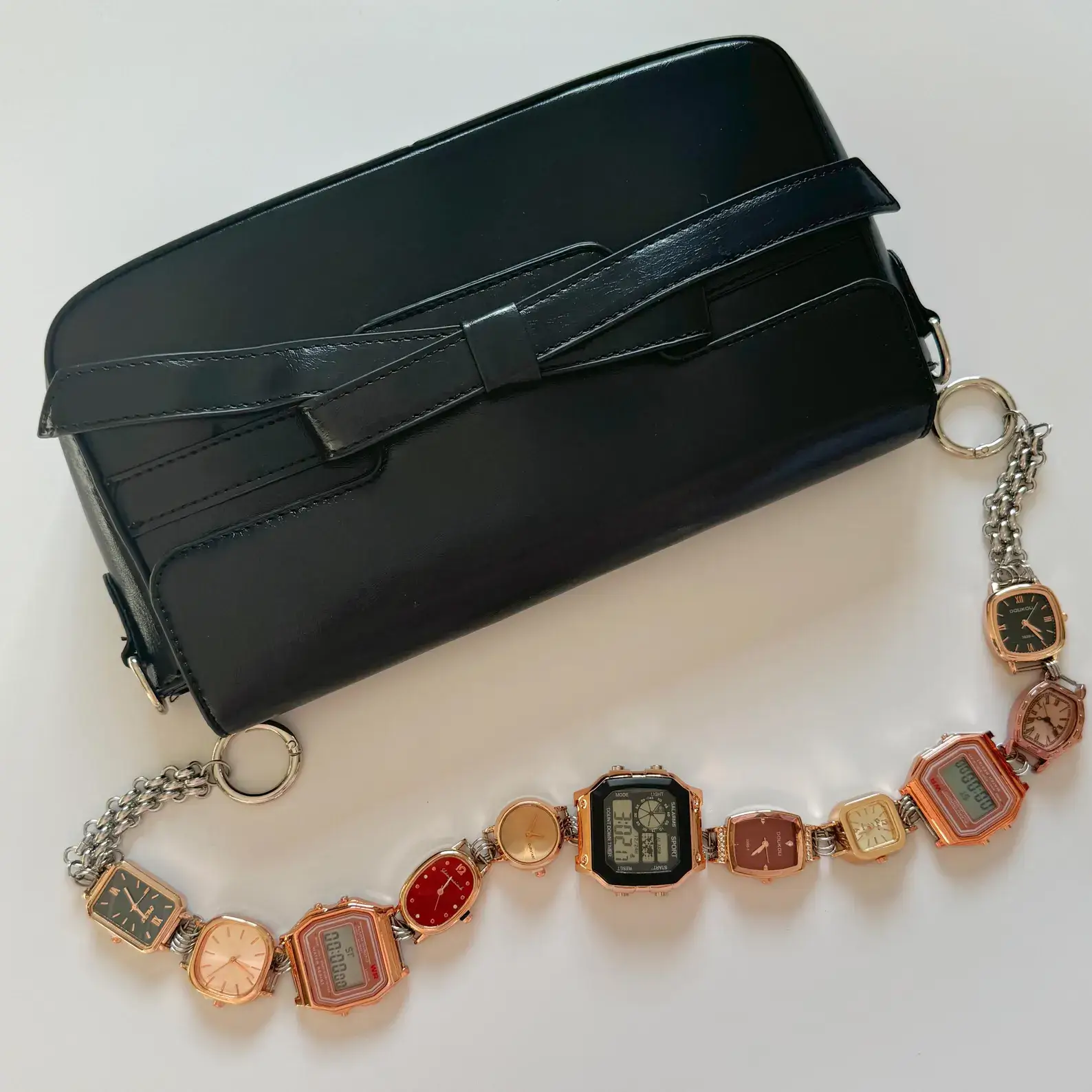 Elegant pearl watch bag chain styled by Bella Hadid