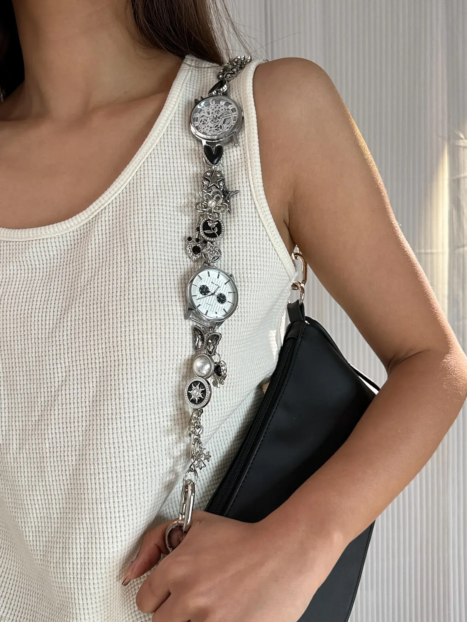 Elegant minimalist silver watch bag chain styled by Bella Hadid