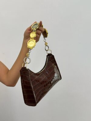 Chrome cyberpunk watch bag chain styled by Billie Eilish