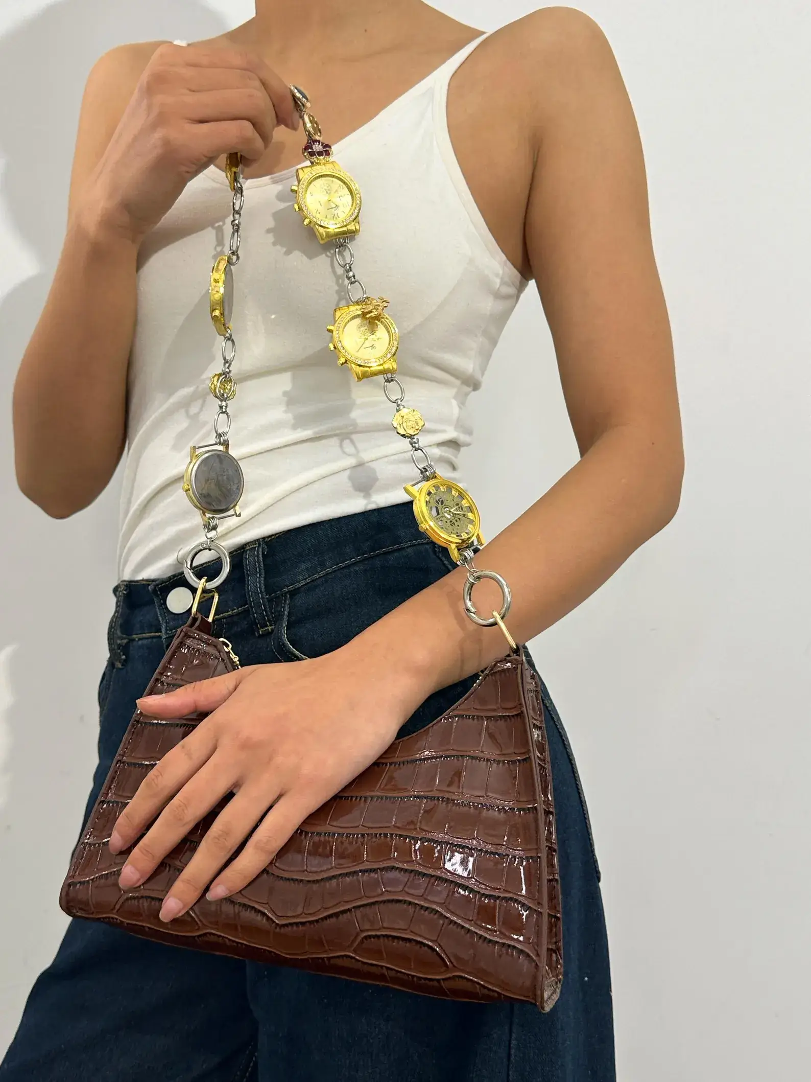Rose gold minimalist watch bag chain worn by Bella Hadid