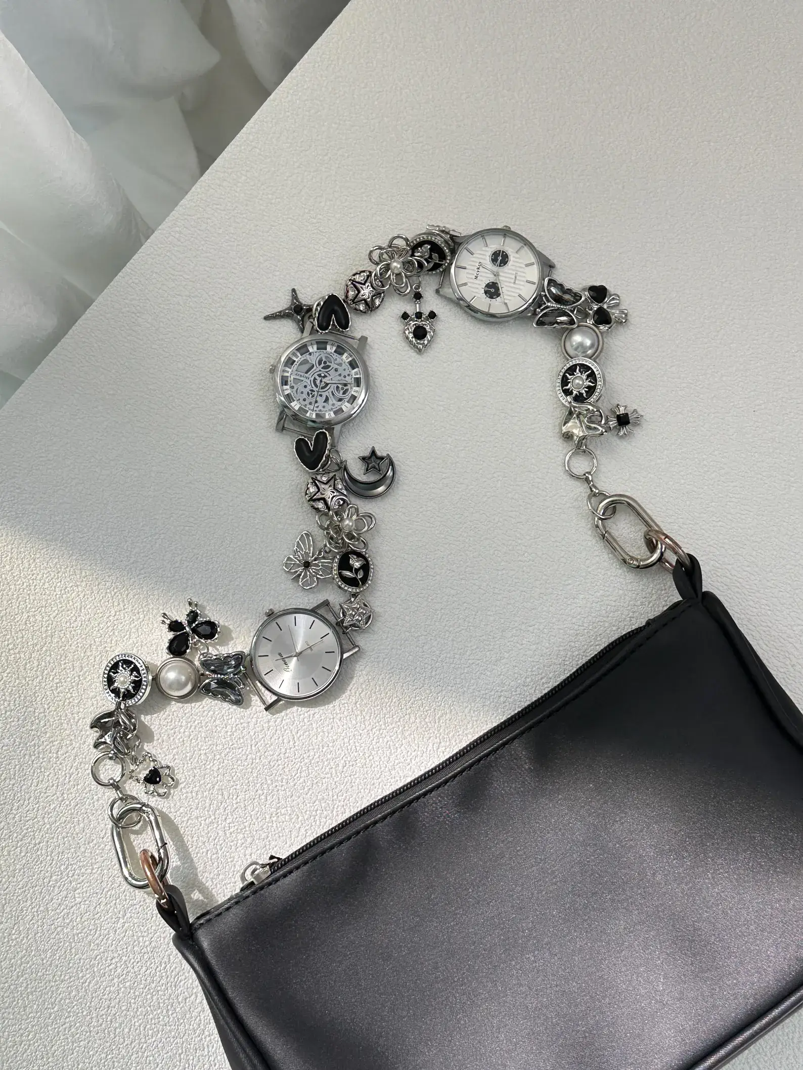 Elegant minimalist silver watch bag chain styled by Bella Hadid