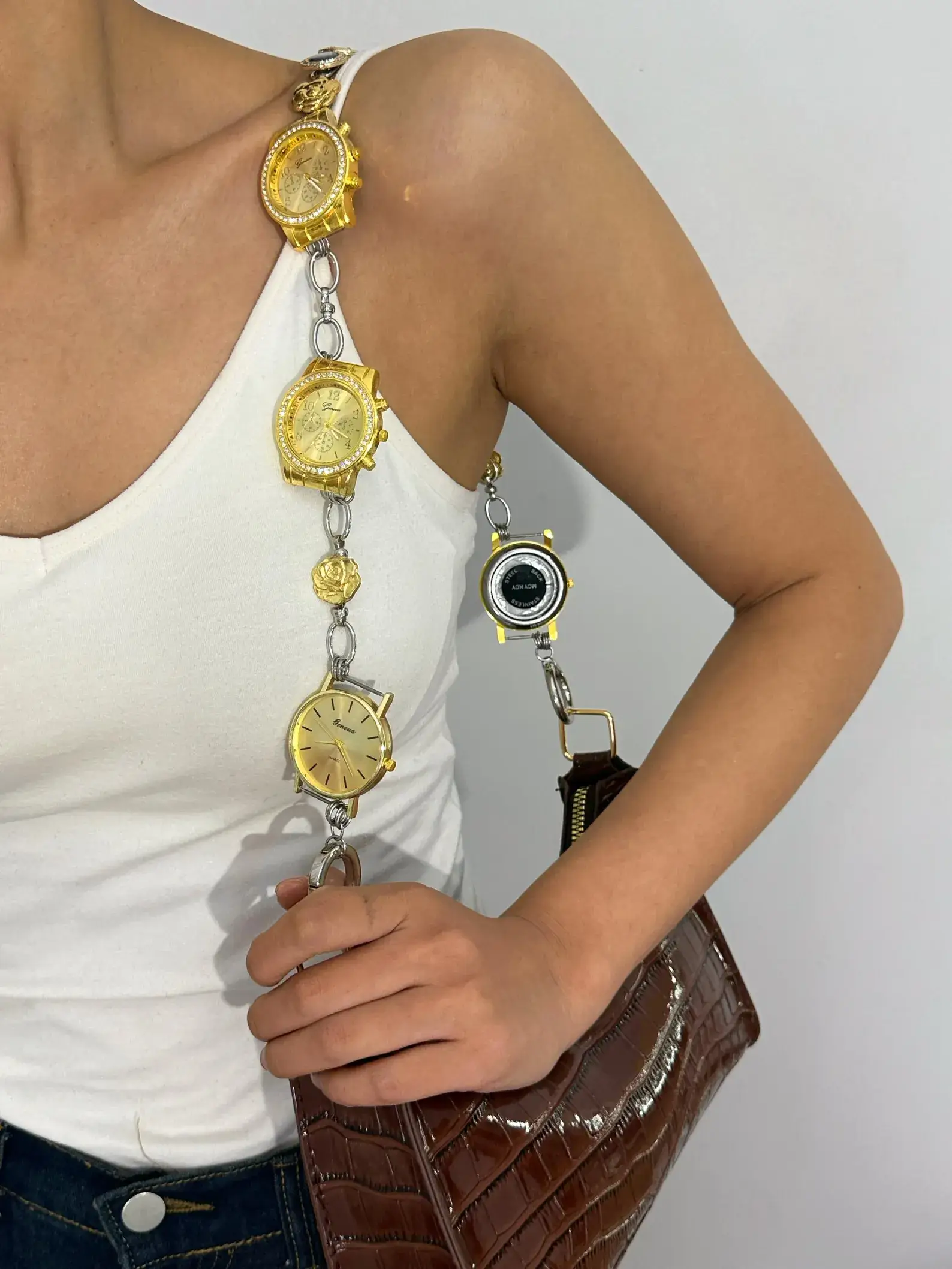 Rose gold minimalist watch bag chain worn by Bella Hadid