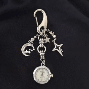Celebrity inspired handmade titanium watch keychain gift: Close-up of a meticulously crafted titanium chain with an elegant, minimalist design, featuring a small watch charm and secure keyring attachment, embodying luxury and personal style.