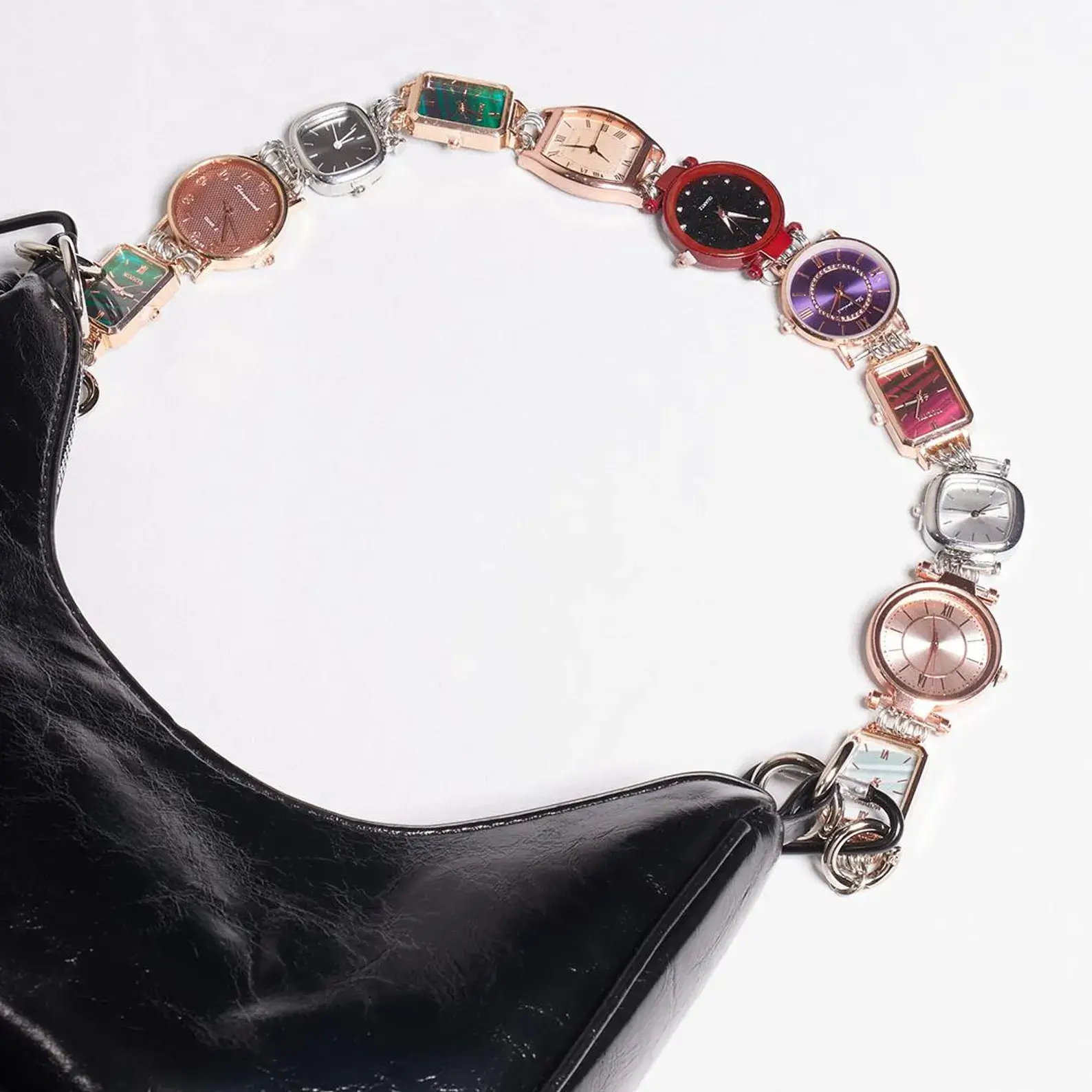 High fashion Prada titanium watch bag chain: Close-up of a sleek, polished titanium chain with Prada's iconic logo charm, featuring an adjustable clasp and versatile design that can be worn as a luxury watch strap or attached to handbags for an instant touch of high-end style.