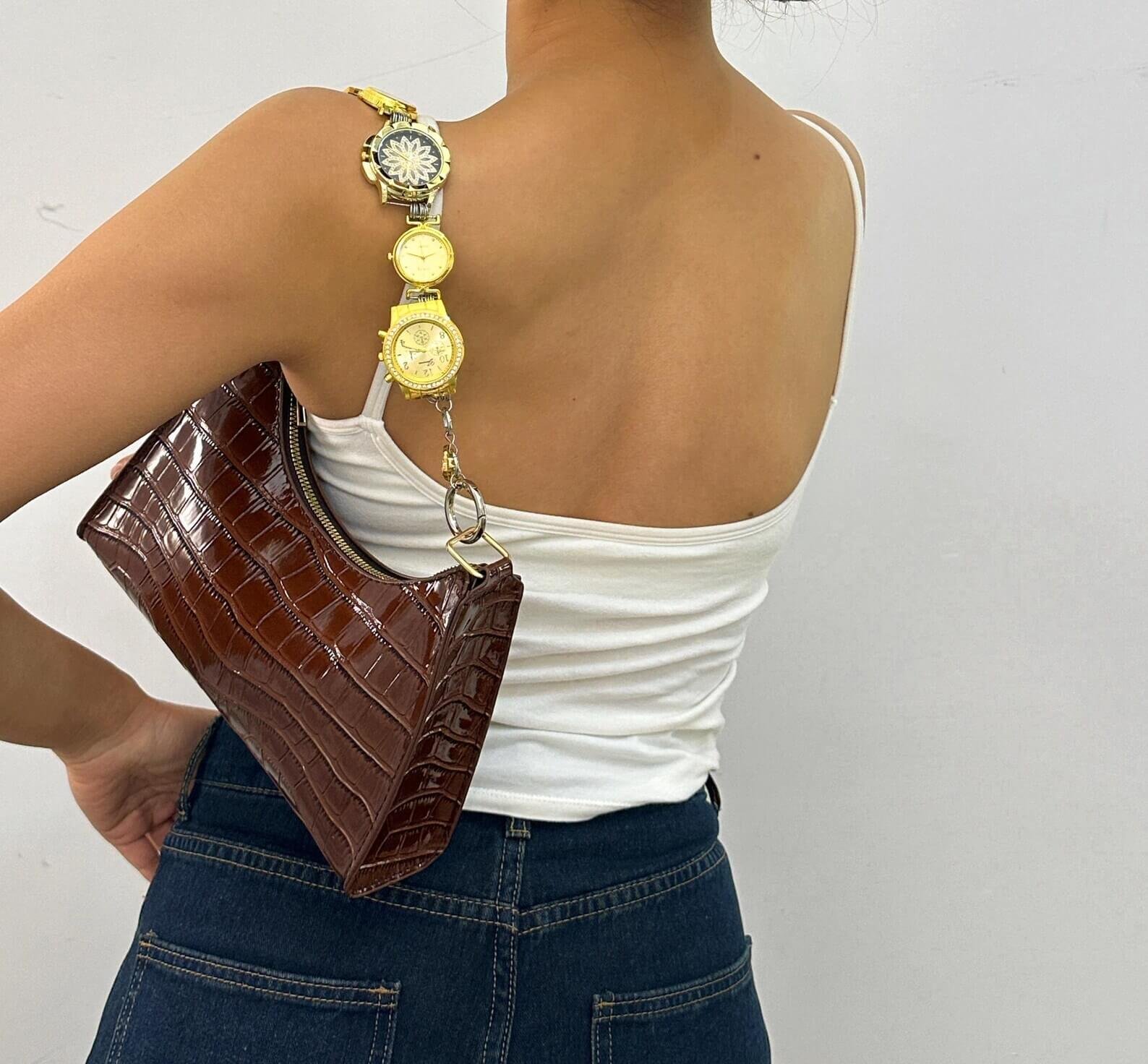 Chrome cyberpunk watch bag chain styled by Billie Eilish