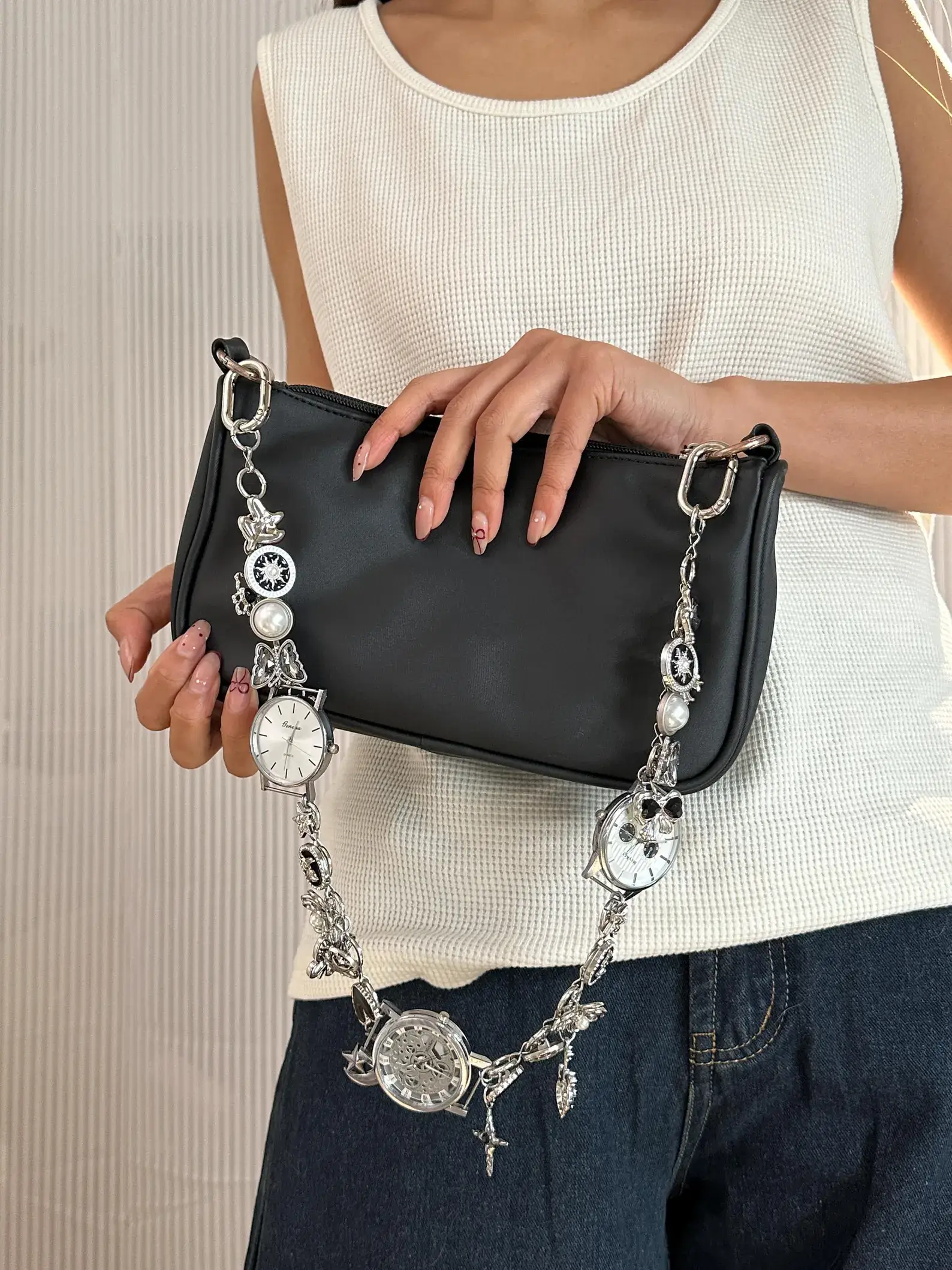 Elegant minimalist silver watch bag chain styled by Bella Hadid