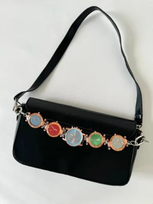 Chrome cyberpunk watch bag chain styled by Billie Eilish