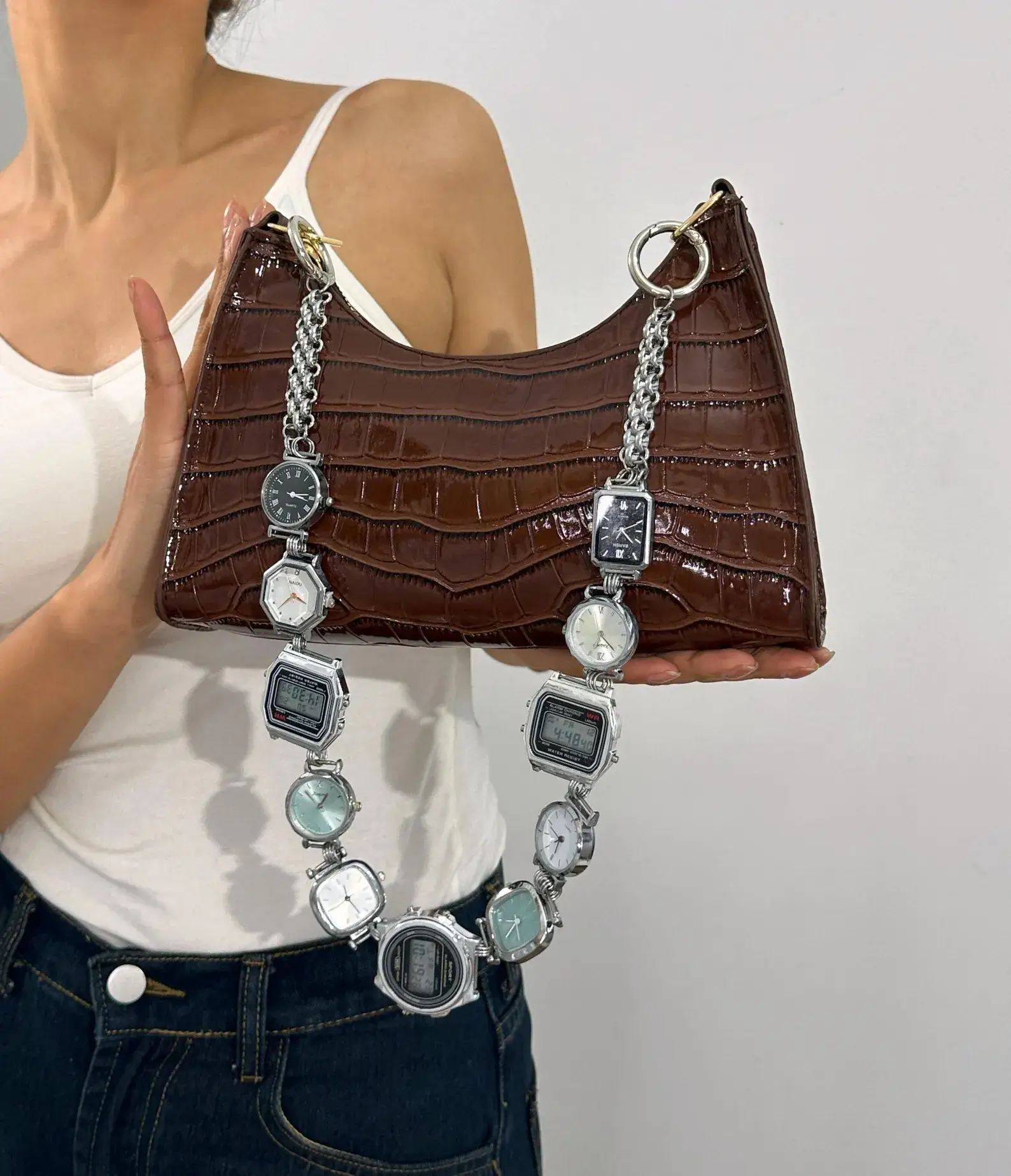 Gothic punk silver bag chain styled by Travis Scott