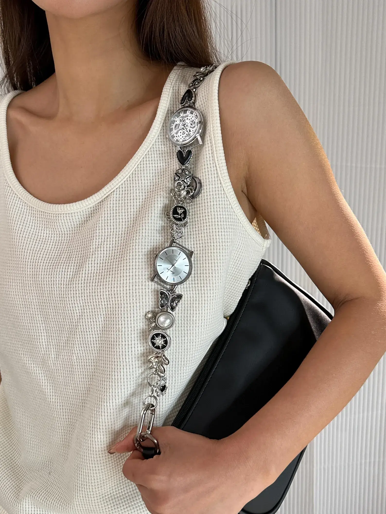 Elegant minimalist silver watch bag chain styled by Bella Hadid