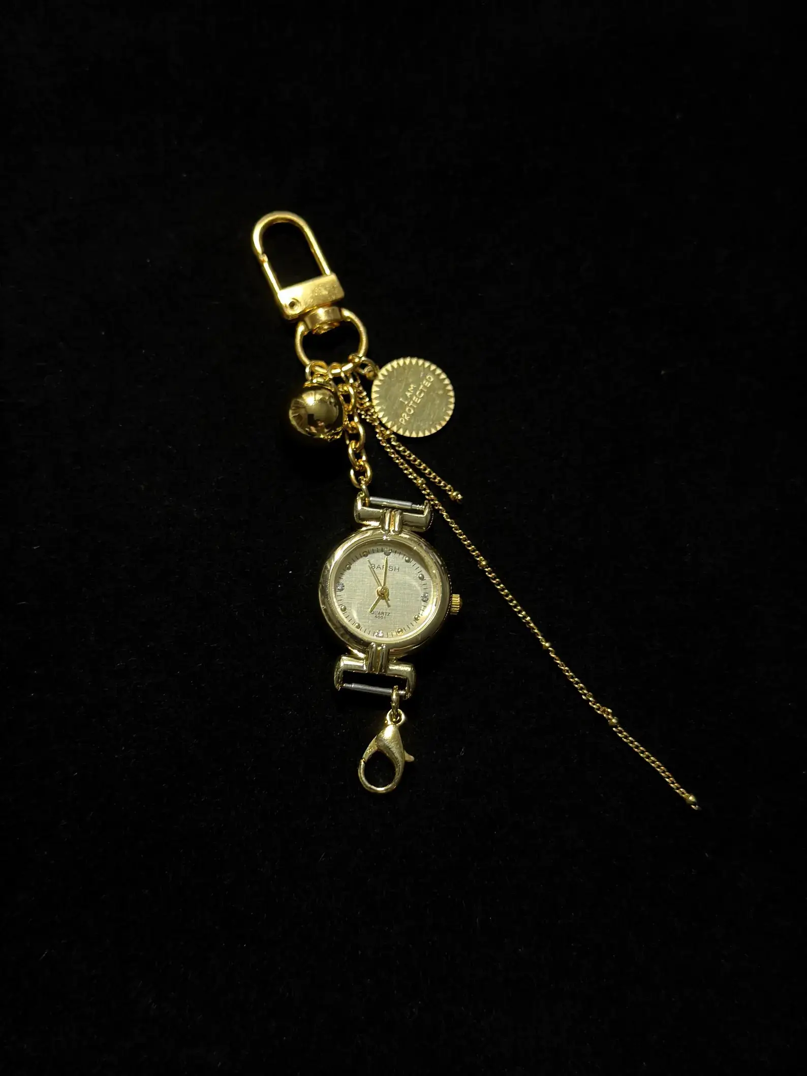 Titanium watch keychain perfect gift for birthdays: A sleek titanium chain with a functional miniature watch, attached to a durable keyring, making it an elegant and practical accessory ideal for gifting on special occasions.